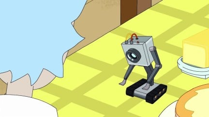 The butter robot in Rick and Morty looks down at its hands.