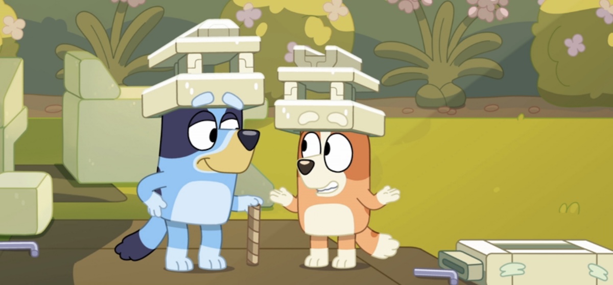 Bluey and Bingo wear hats made of packing foam.