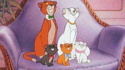 Tom, Duchess, and the kittens smile on the couch in Aristocats.