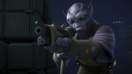 Image of Zeb Orrelios in a scene from the Disney XD animated series 'Star Wars: Rebels.' Zeb is non-human, and is large, purple, and has pointy ears and a bald, ridged head with darker purple markings. He's aiming a blaster at someone.