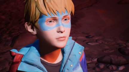 A young blonde boy video game character with a blue mask drawn onto his face like a superhero's mask