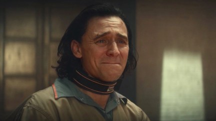 Loki holds back tears, wearing his TVA prisoner jumpsuit.