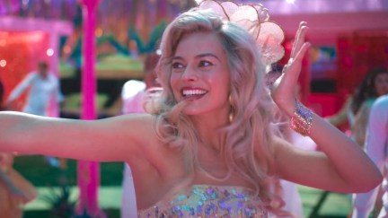 Barbie (Margot Robbie) dances and grins.