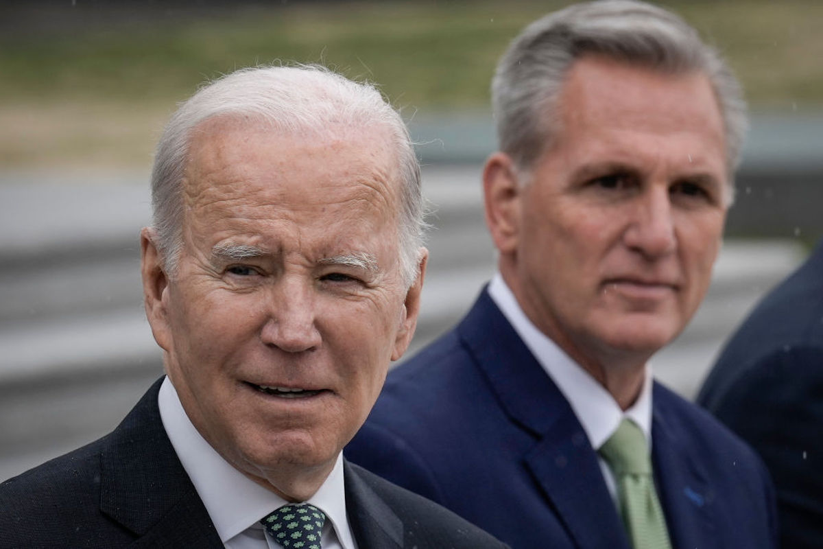 Joe Biden and Kevin McCarthy both give semi-smirks.