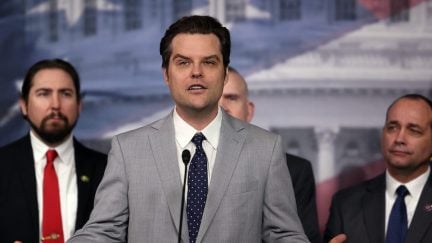 Matt Gaetz speaks from a podium and gestures broadly.