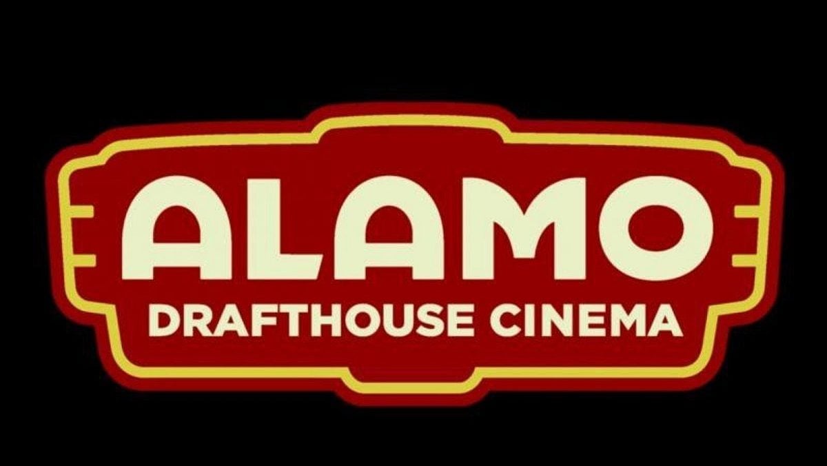 The Alamo Drafthouse Cinema logo. The words are in white on a red logo outlined in yellow, and the whole thing is on a black background.