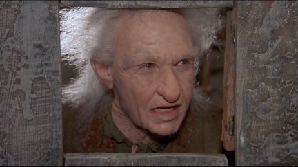 Miracle Max pokes his face through a doorway in The Princess Bride.