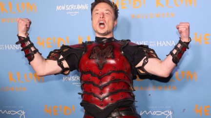 Elon Musk flexing like a doofus in weird armor at a Halloween party.