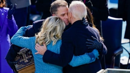 Hunter Biden hugs Joe and Jill Biden.