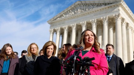 Lorie Smith, the owner of 303 Creative, a website design company in Colorado, speaks to reporters outside of the U.S. Supreme Court Building.