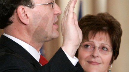 U.S. Supreme Court Justice Samuel Alito (L) is sworn in as his wife Martha-Ann Bomgardner looks on