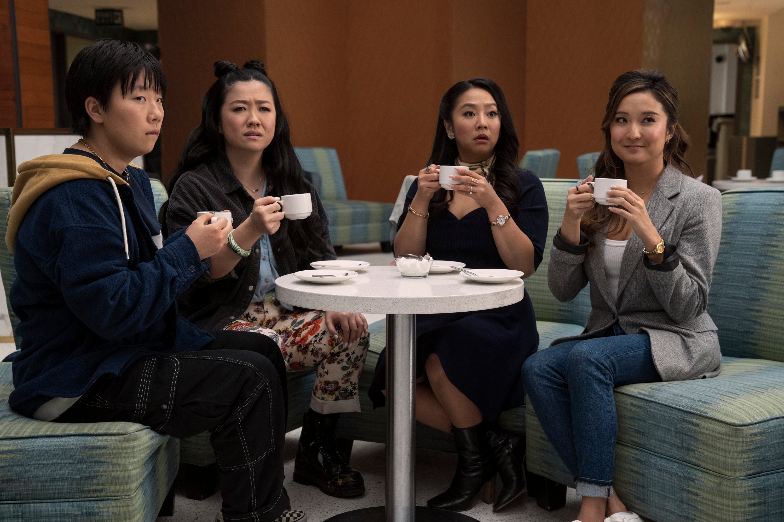 All four girls debrief with tea after a crazy night.