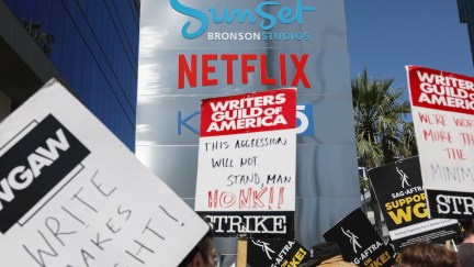 Writers Guild and SAG AFTRA members on a picket line protesting Netflix's refusal to pay fair wages and safeguard against AI