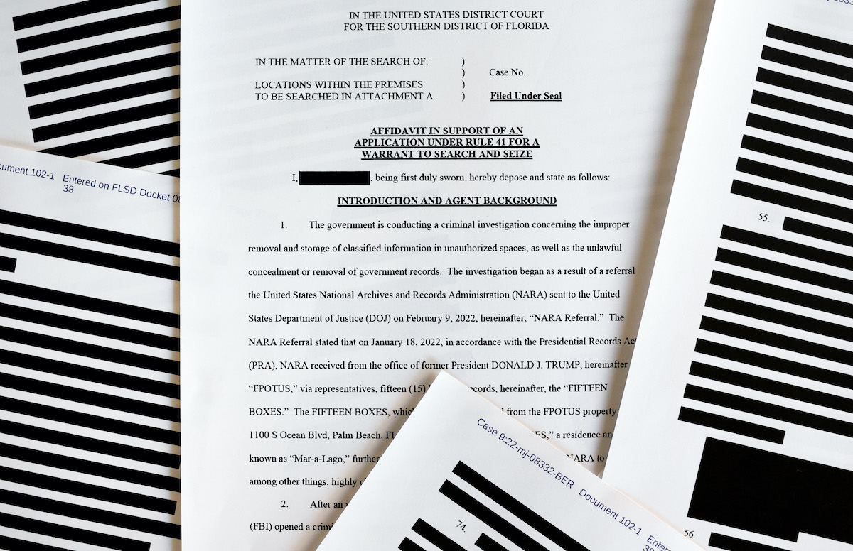 pages from the government’s released version of the F.B.I. search warrant affidavit for former President Donald Trump's Mar-a-Lago estate