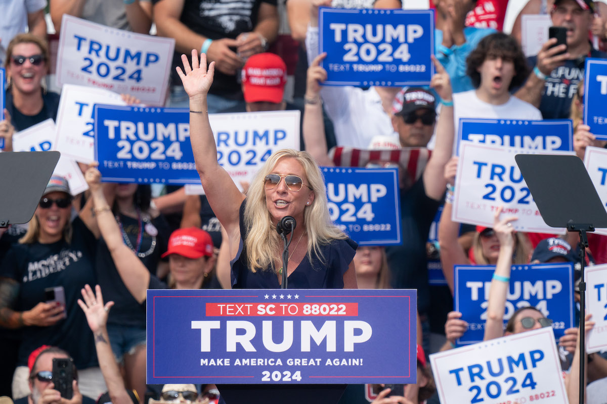 Marjorie Taylor Greene speaks at a Trump rally.