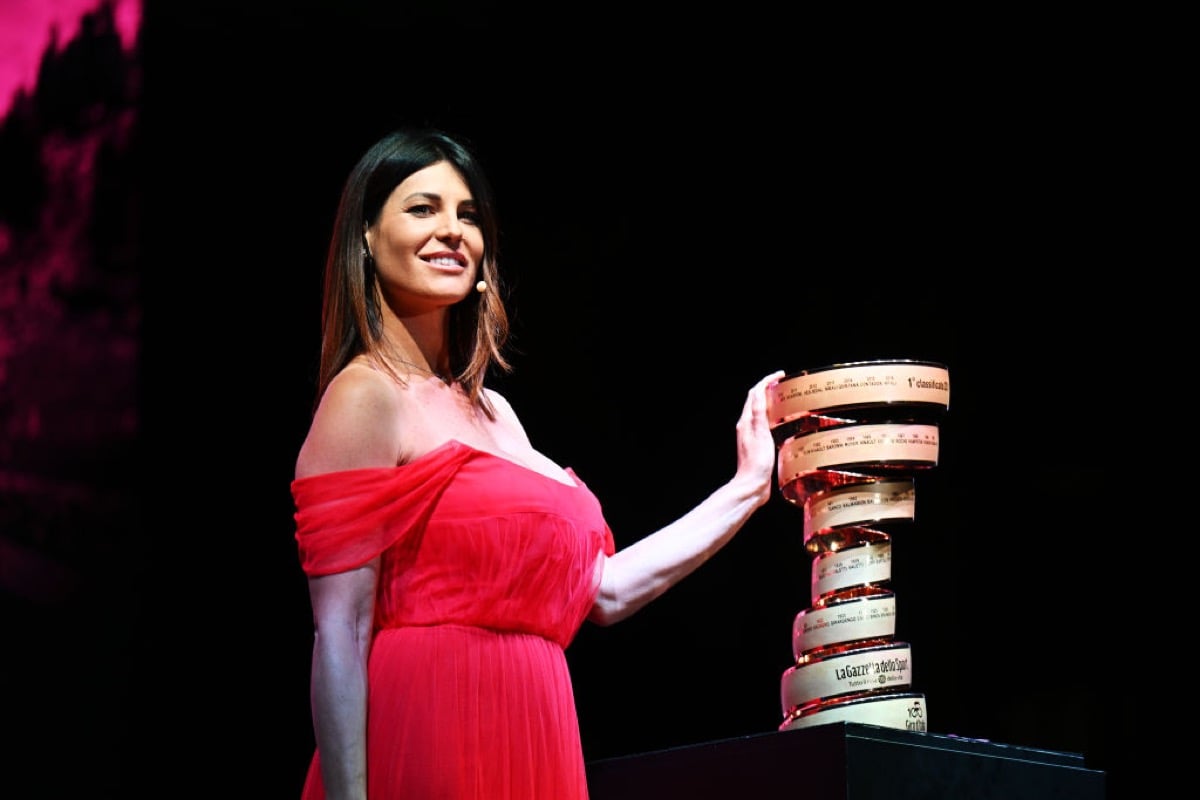 Barbara Pedrotti of Italy former Miss Italy and Journalist poses with the Trofeo Senza Fine during the 106th Giro d'Italia 2023.