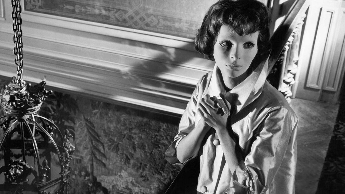 Christians from eyes without a face clasping her hands together in "Eyes without a face"