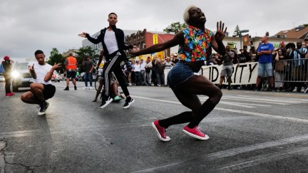 NEW YORK, NEW YORK - AUGUST 04: People gather at a memorial for O’Shae Sibley on August 04, 2023 in New York City. The memorial was held at the gas station where he was murdered last weekend while dancing with friends. Sibley and friends started 