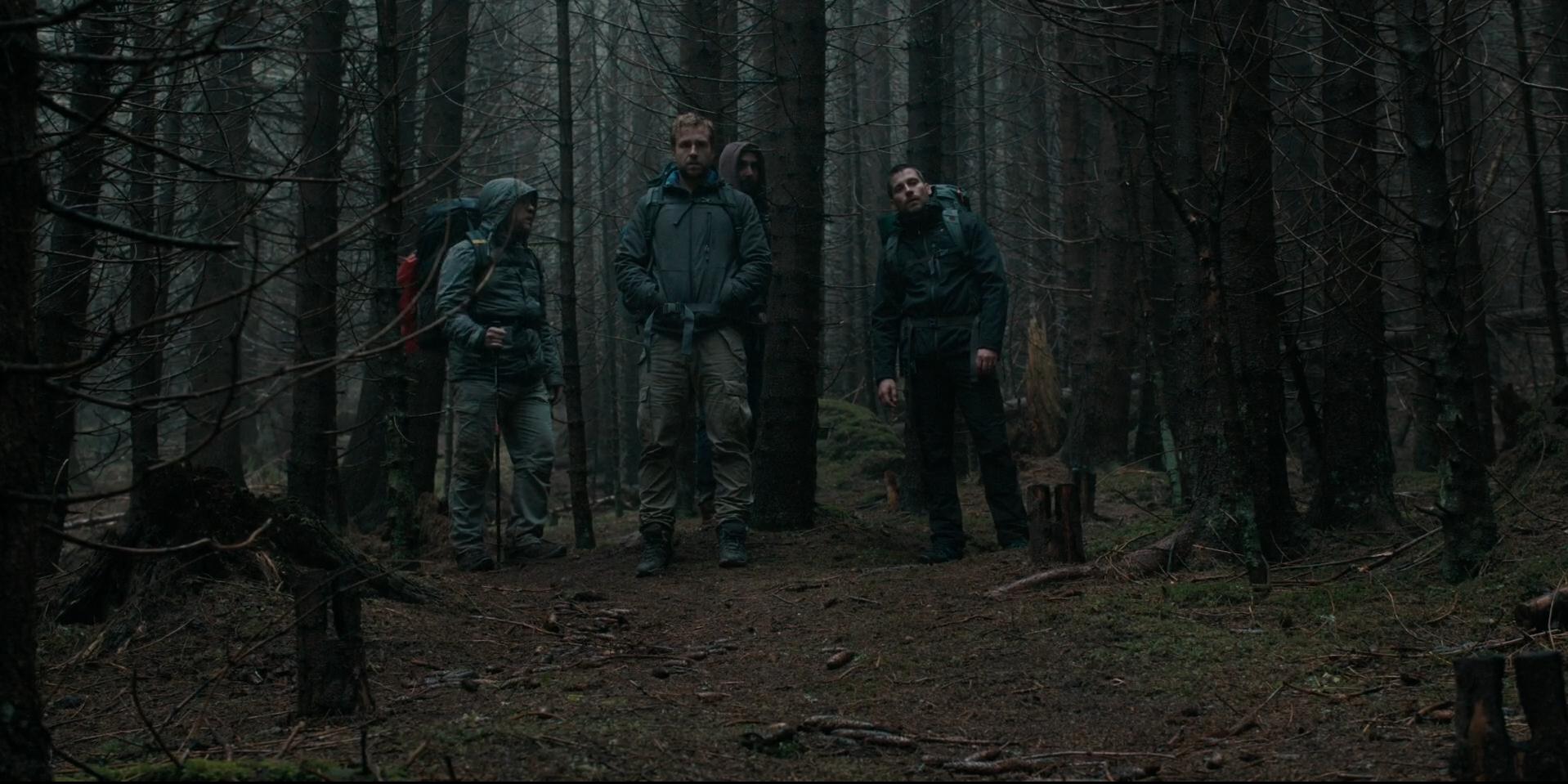 Phil (Arsher Ali), Dom (Sam Troughton), Hutch (Robert James-Collier), and Luke (Rafe Spall) get lost in the woods in 'The Ritual.'