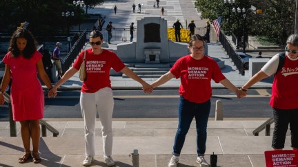 NASHVILLE, TENNESSEE - AUGUST 21: Gun reform activists join hands and surround the Tennessee State Capitol in prayer ahead of a special session on August 21, 2023 in Nashville, Tennessee. Republican Tennessee Governor Bill Lee called for the special legislation session on public safety in response to public outcry after the The Covenant School mass shooting, where three children and three staff were killed. (Photo by Jon Cherry/Getty Images)