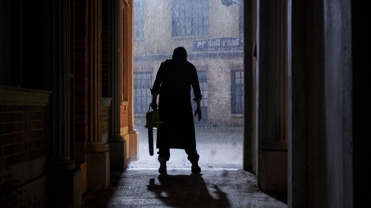 Leatherface in 'The Texas Chainsaw Massacre' 2022 sequel: A large man is seen in silhouette holding a chainsaw