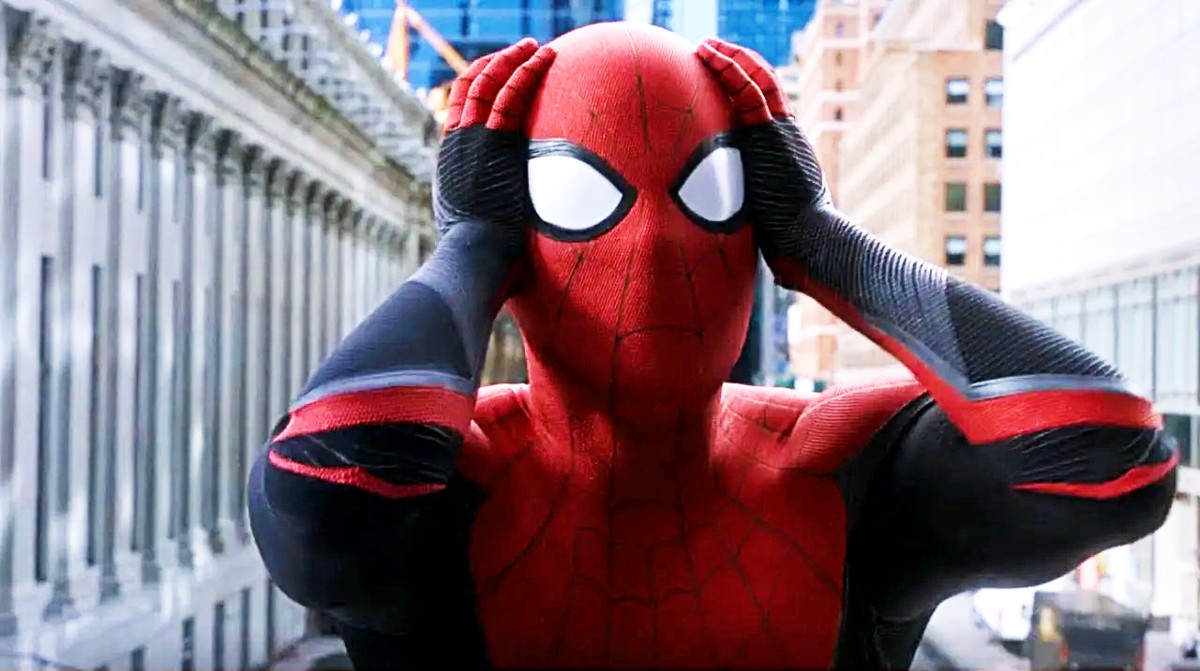 Tom Holland as Spider-Man holding his head in Spider-Man: Homecoming