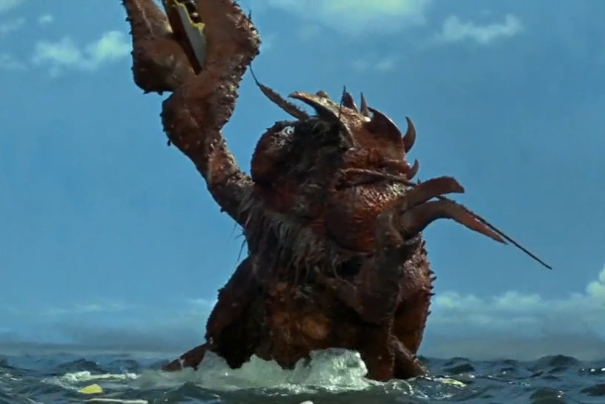 Still from Ebirah; a giant lobster rises from the sea, shaking its claw.