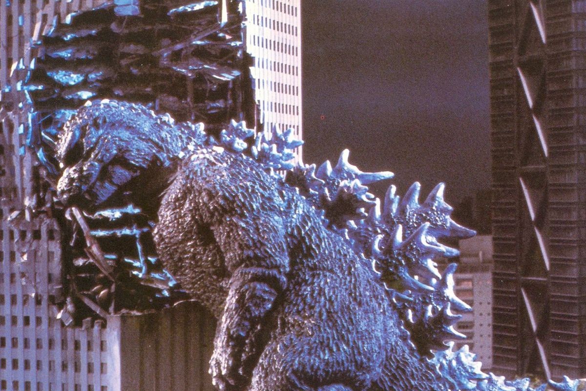 Still from Godzilla 1984; Godzilla headbutts a building.