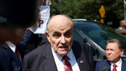 Rudy Giuliani speaks to reporters.