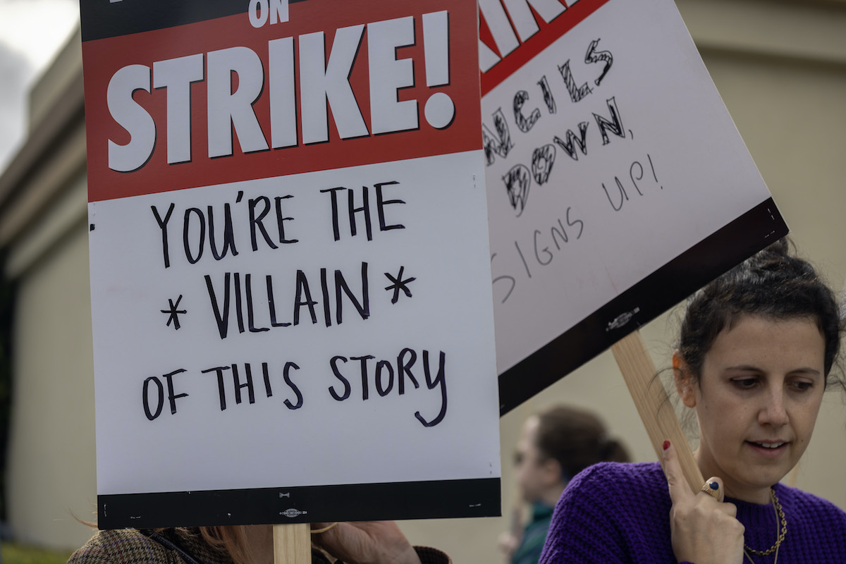 Writers picket outside a Hollywood studio.