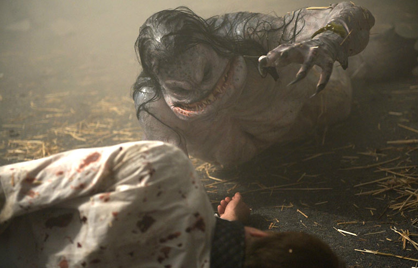 A wounded Facility technician is attacked by a Merman creature in ‘The Cabin in the Woods.’