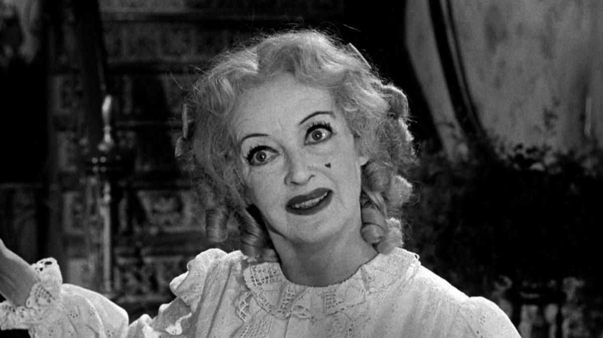 An old woman smiles creepily in "Whatever Happened To Baby Jane"