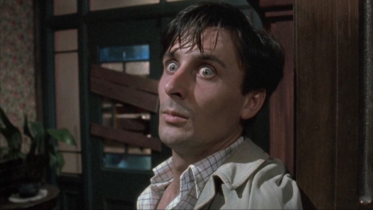 A man stares in wide eyes terror in "Dead Alive" 