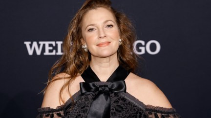 Drew Barrymore smiles on a red carpet.