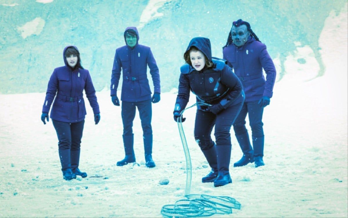 Mary Wiseman as Tilly leads three cadets on an away mission on an icy planet