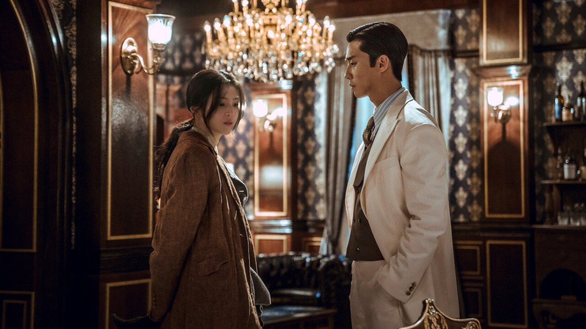 Gyeongseong Creature featuring Han So-hee on the left, standing beside Park Seo-jun in what is presumed to be his character