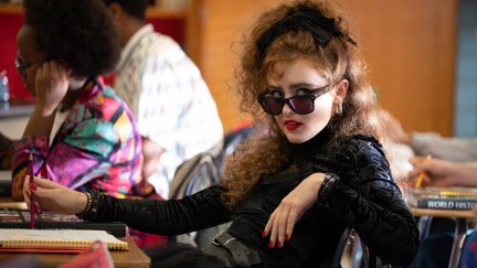 An 80s goth girl sits in a high school classroom in 'Lisa Frankenstein.'