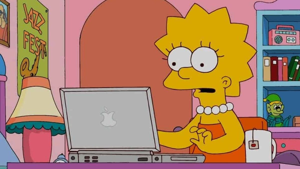 Lisa Simpson sits at her computer with a cup of tea ready to write on 'The Simpsons.'