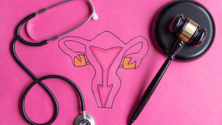 Drawing of female reproductive system with judge's gavel and stethoscope.