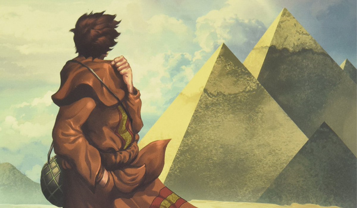 Cover art for the Hardcover version of Paulo Coelho's The Alchemist: A Graphic Novel, featuring a figure facing the pyramids of Giza in Egypt.