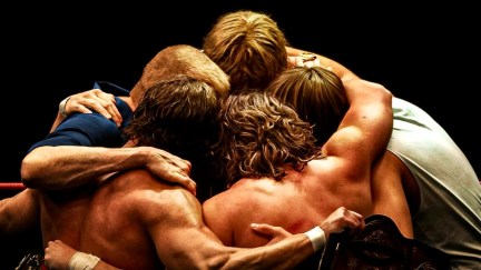 The Von Erich family in a huddle in The Iron Claw