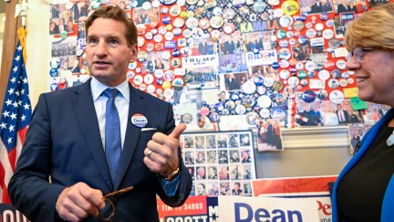 Dean Phillips (D-MN)(R) visits the candidate wall at the N.H. Statehouse