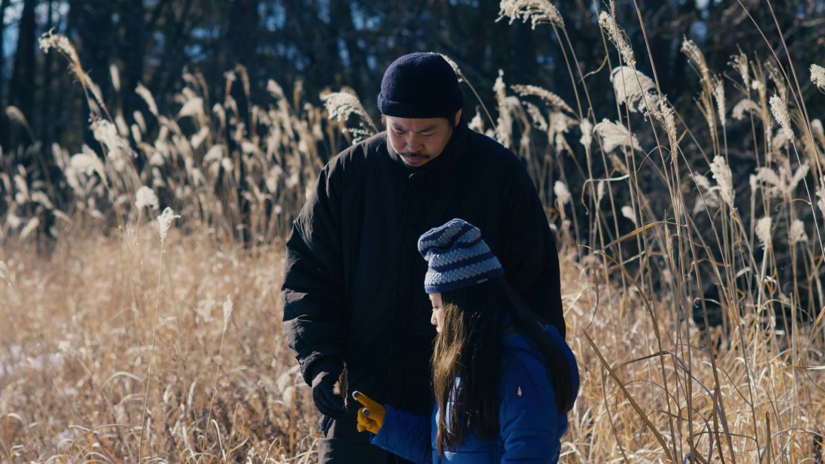 Hana and her father Takumi observing nature in 'Evil Does Not Exist'