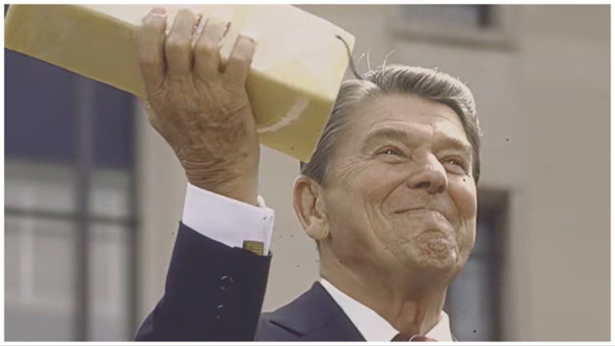 Ronald Reagan holds a block of government cheese.