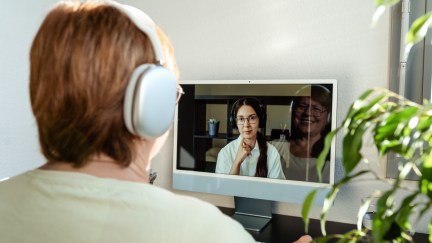 A woman receives telemedicine therapy.