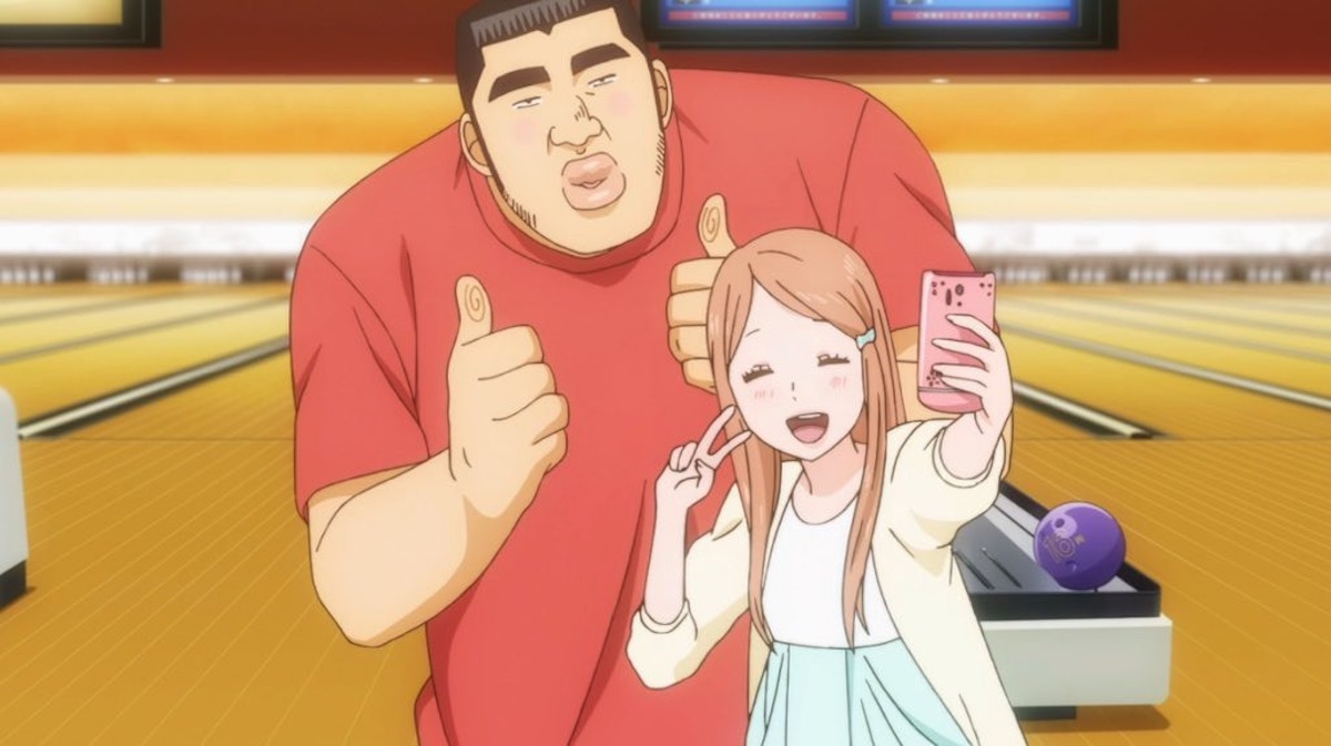 Takeo Gouda and Rinko Yamato take a cute selfie in a bowling alley