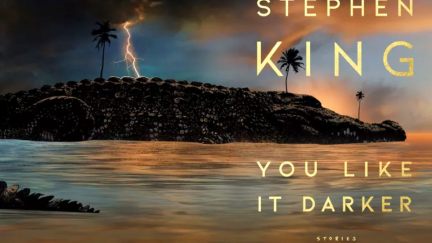 A large alligator floats in water under a stormy sky on the cover of 'You Like It Darker' by Stephen King.