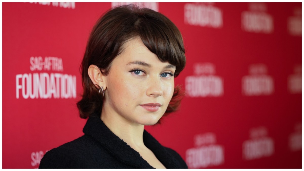 Cailee Spaeny, a woman with brown hair and a black jacket.