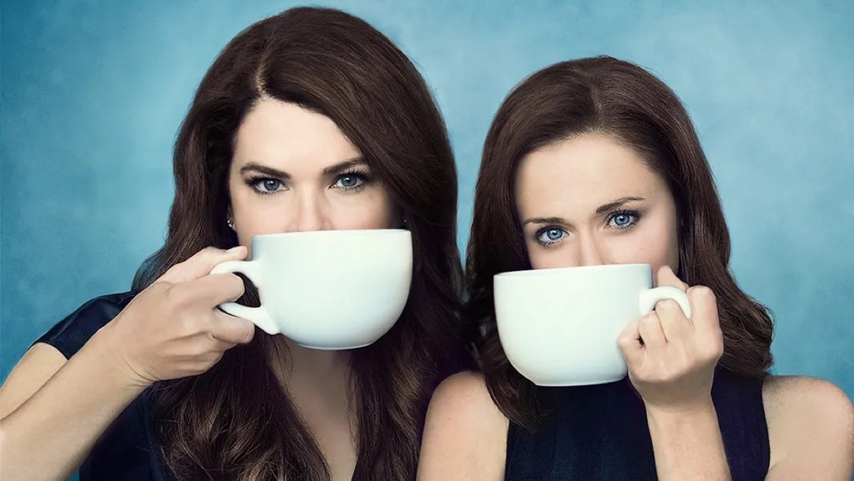 The Gilmore Girls, drinking coffee, allegedly, in promo art for Netflix's Gilmore Girls: A Year in the Life.