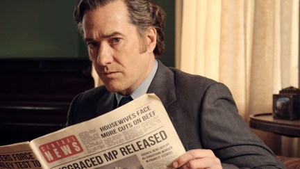 Matthew MacFadyen holds a newspaper in 'Stonehouse'